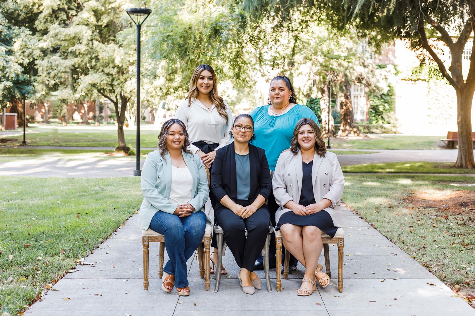 5 females smiling at camera